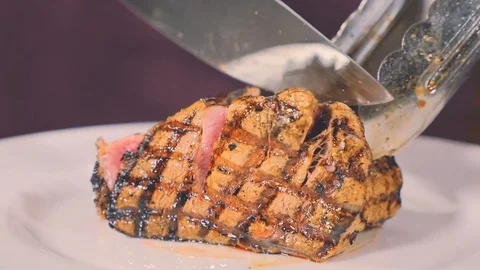 Chef prepares a meat dish in the kitchen of a restaurant Stock Footage 71673366