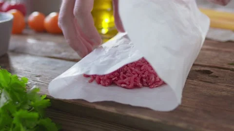 The chef prepares mince meat in the kitchen, dish with beef macro 動画素材 142943198