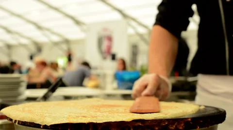 Chef prepares a pancake - both warming surface Stock Footage 49899248