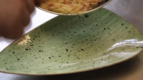Chef prepares pasta a dish in a restaurant kitchen Stock Footage 83591231