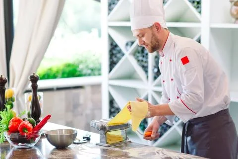 The chef prepares the paste for the visitors. Stock Photos