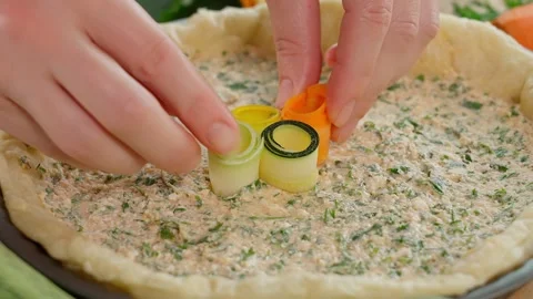 The chef prepares a pie with multi-colored zucchini and carrots, Tuscan pie Stock Footage 264141623