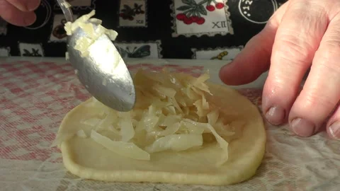 The chef prepares pies with cabbage Stock Footage 164359786