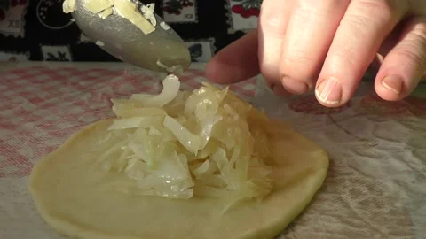 The chef prepares pies with cabbage Stock Footage 164360690