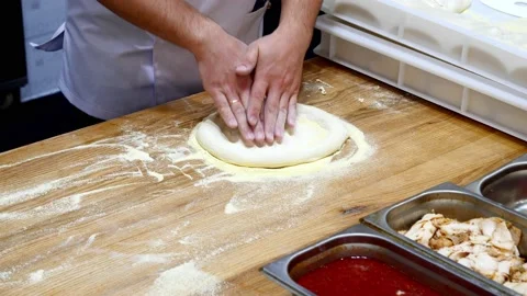 The chef prepares pizza dough Stock Footage 232580579