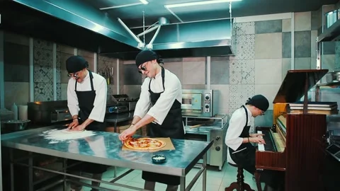 The chef prepares pizza in the kitchen. Stock-Footage 154455413