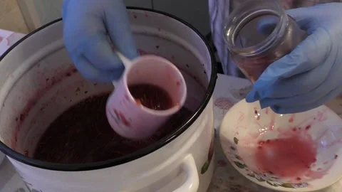 The chef prepares raspberry jam Stock Footage 165495159