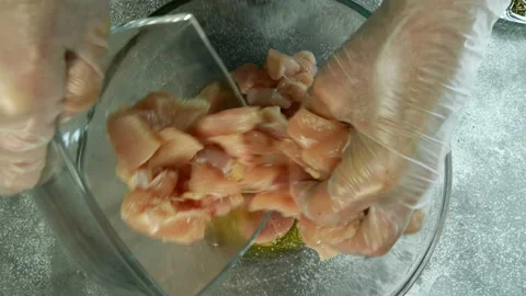 Chef prepares raw chicken breast. Stock Footage 132174719