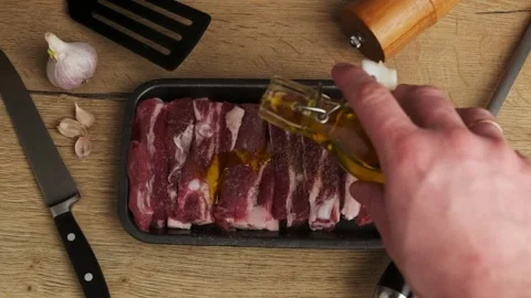 Chef prepares raw pork meat for roasting Stock Footage 238904498