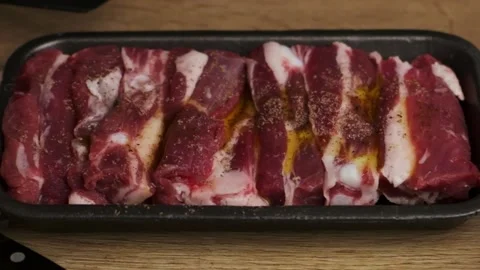 Chef prepares raw pork meat for roasting Stock Footage 239661829