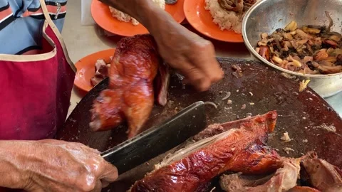 Chef prepares Roasted Duck in a restaurant of Georgetown, Penang, Malaysia 4K Stock Footage 260697894