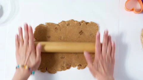 The chef prepares by rolling out raisin dough for cookies. 4K. Stock Footage 155015446