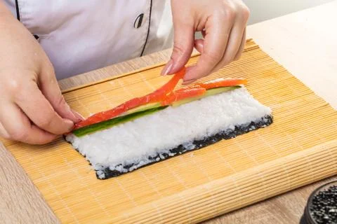 Chef prepares rolls, hands closeup Stock Photos