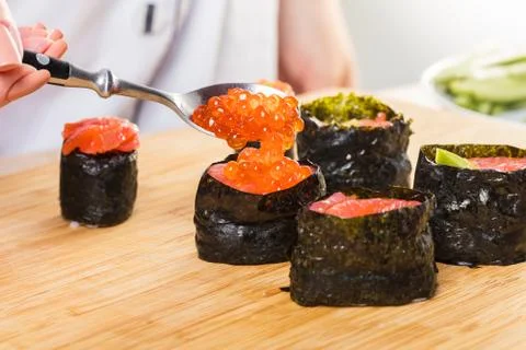 Chef prepares rolls, hands closeup Foto stock