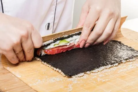 Chef prepares rolls, hands closeup Stock-Fotos