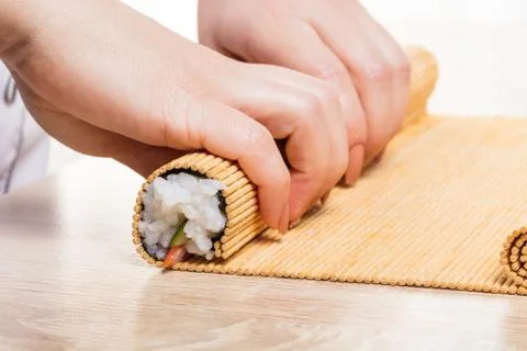 Chef prepares rolls, hands closeup Stock Photos