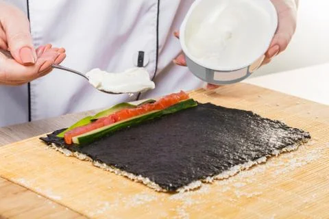 Chef prepares rolls, hands closeup Stock Photos
