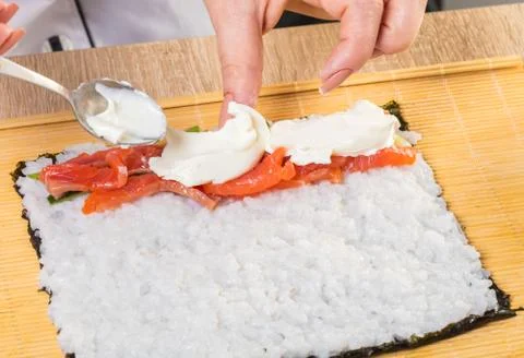 Chef prepares rolls, hands closeup Foto stock