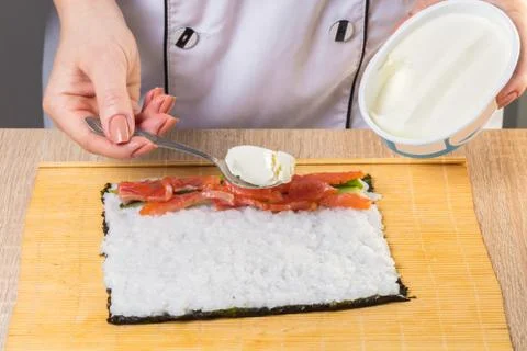 Chef prepares rolls, hands closeup Stock Photos