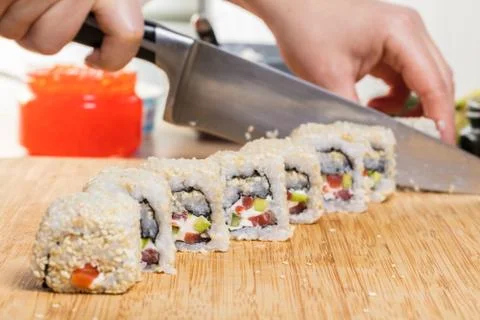 Chef prepares rolls, hands closeup Stock Photos