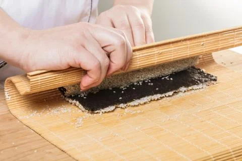 Chef prepares rolls, hands closeup Stock Photos