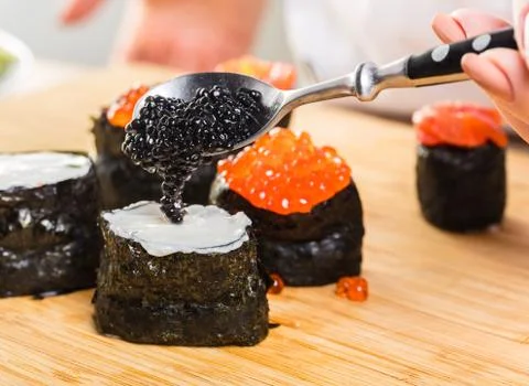 Chef prepares rolls, hands closeup Stock Photos