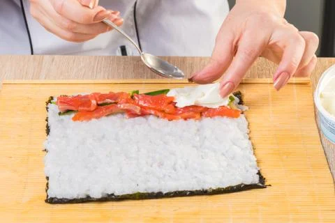 Chef prepares rolls, hands closeup Stock Photos