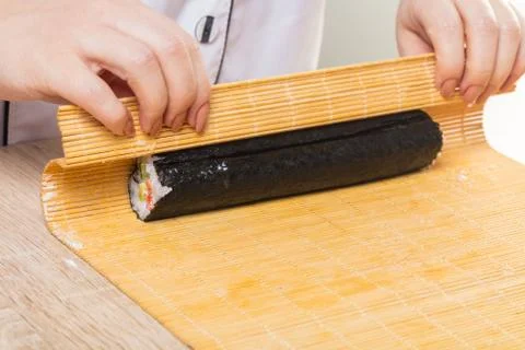 Chef prepares rolls, hands closeup Stock Photos