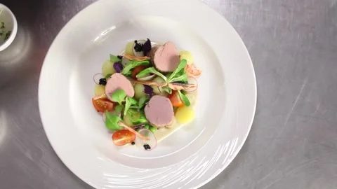 The chef prepares a salad of greens and black caviar Stock Footage 170754758