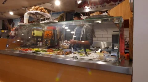 Chef Prepares Salads in Cafe Behind Counter 動画素材 57307173