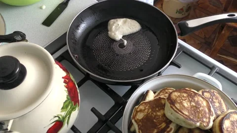 The chef prepares small pancakes Stock Footage 187633775