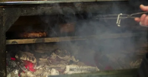 Chef prepares steak 4k video: flips meat grill charcoal oven. Barbecue kitchen Stock Footage 70006085