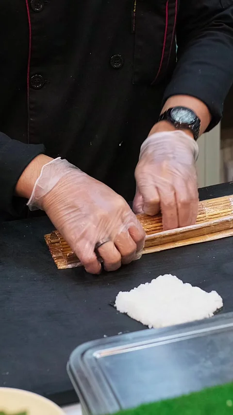 Chef prepares sushi with precision and care. Stock Footage 340339081