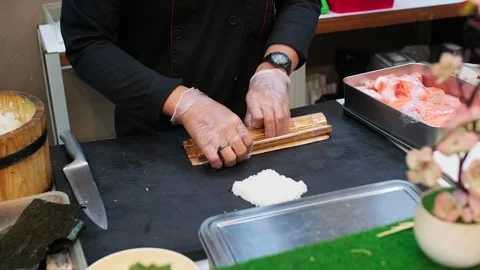 Chef prepares sushi with precision and care. Stock Footage 340339103