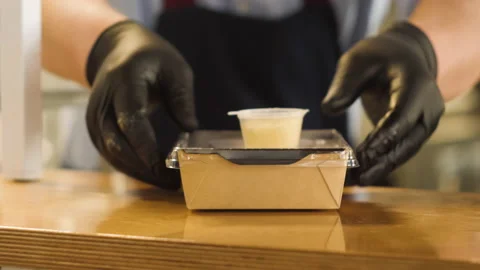 The chef prepares take-away pasta Video stock 148130136