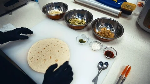 The chef prepares a tortilla. Acceleration. Average plan Stock Footage 87135641