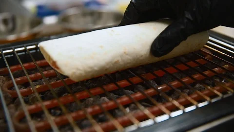 The chef prepares a tortilla. Roasters. Close up Stock Footage 87135506