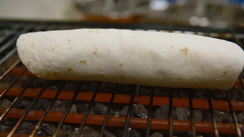 The chef prepares a tortilla. Roasters. Close up Stock Footage 87135545