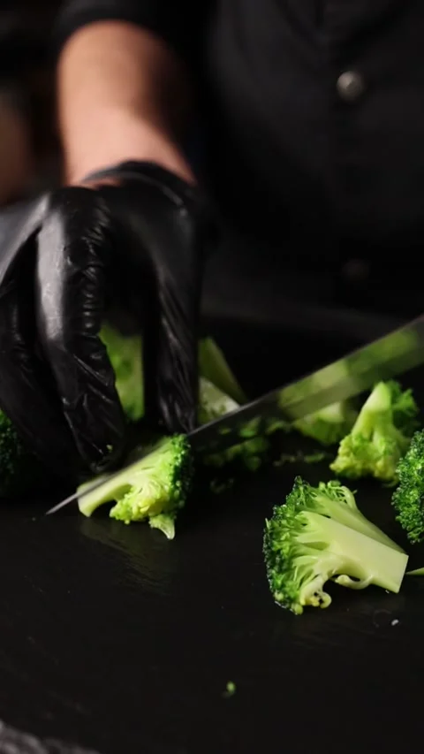 The chef prepares a vegetable dish. Close-up Stock Footage 265671127