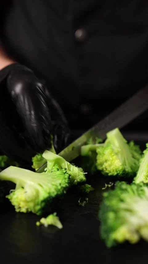 The chef prepares a vegetable dish. Close-up Stock Footage 265671189