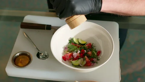 The chef prepares a vegetable salad Stock Footage 136999710