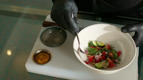 The chef prepares a vegetable salad Stock Footage 136999862