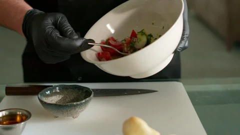 The chef prepares a vegetable salad Stock Footage 136999887