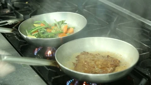 Chef prepares vegetables and beef steak Stock Footage 122065551