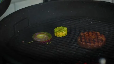 The chef prepares vegetables and meat on the grill Stock Footage 131152125