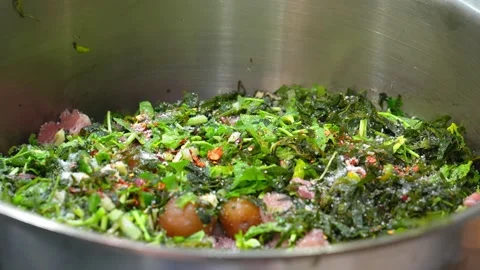Chef prepares vegetarian salad in kitchen, he salts and adds spices, Stock Footage 267672003