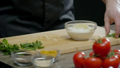 The chef prepares white sauce in the kitchen of the restaurant from various Stock Footage 270501846