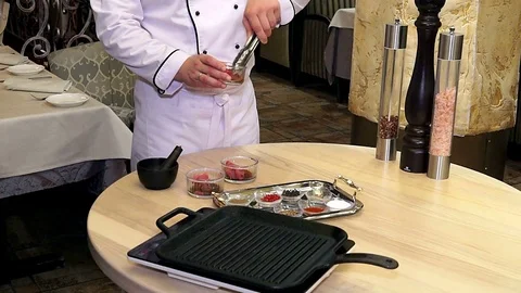 Chef preparing and spicing meat Video stock 98755647