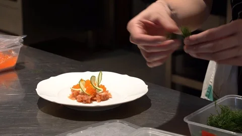 Chef preparing an appetiser dish in the restaurant kitchen. Stock Footage 108523563