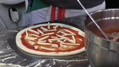 Chef preparing artisanal classic Italian Margherita pizza to bake in oven Video stock 85961684